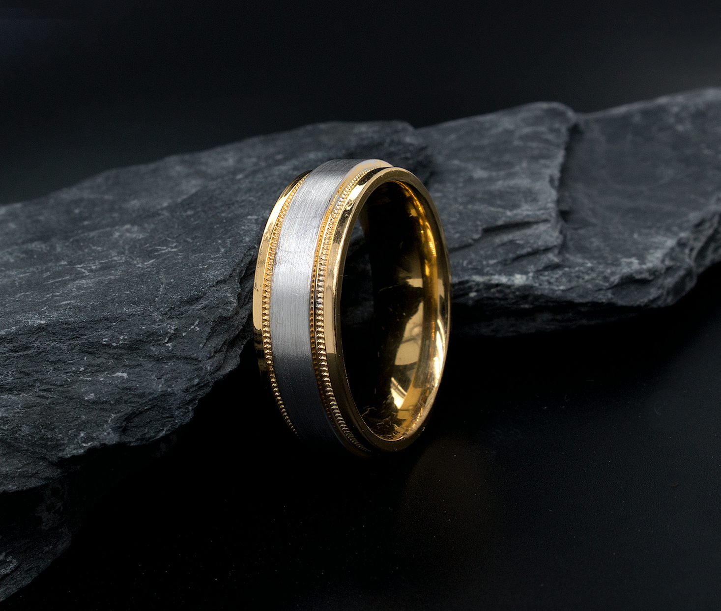 ring, ring on white background, mens rings, womens ring, unisex ring, two toned ring, yellow gold and white gold ring, brushed center, polished edges and interior, migrain engraving, stepped edges, wedding band, mens wedding band, womens wedding band, minimalist ring