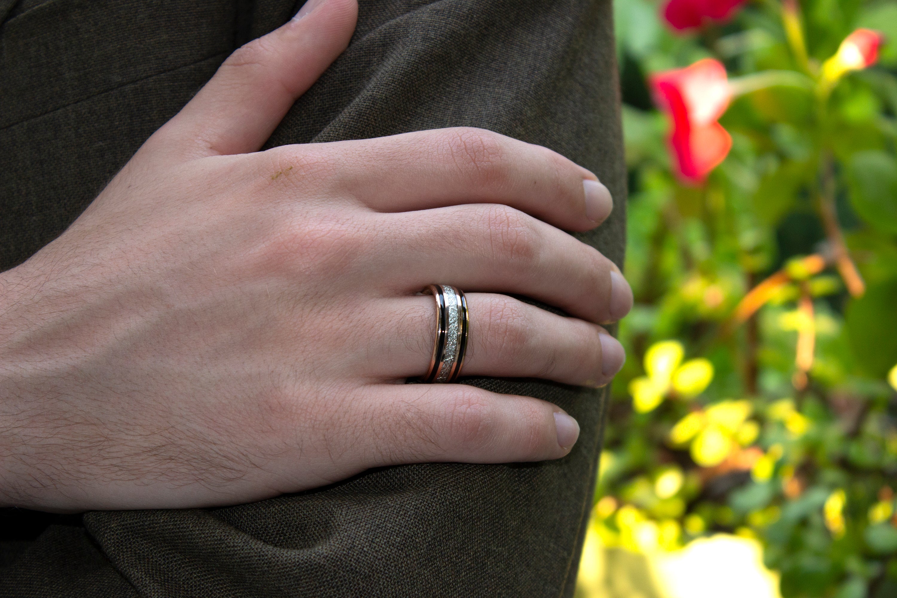 rose gold ring, tungsten ring, ring with meteorite inlay, plans, suit, ring on hand