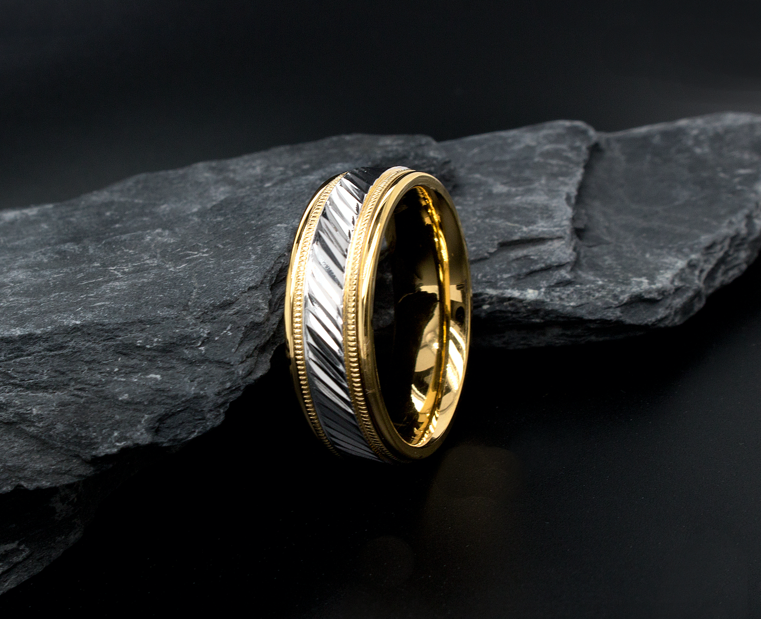 two toned ring, solid gold ring, white gold and yellow gold ring, grooved pattern, diagonal grooves, stepped edges, migrain engraving, polished ring, mens wedding band, womens wedding band, unisex ring, custom made ring, ring on rocks