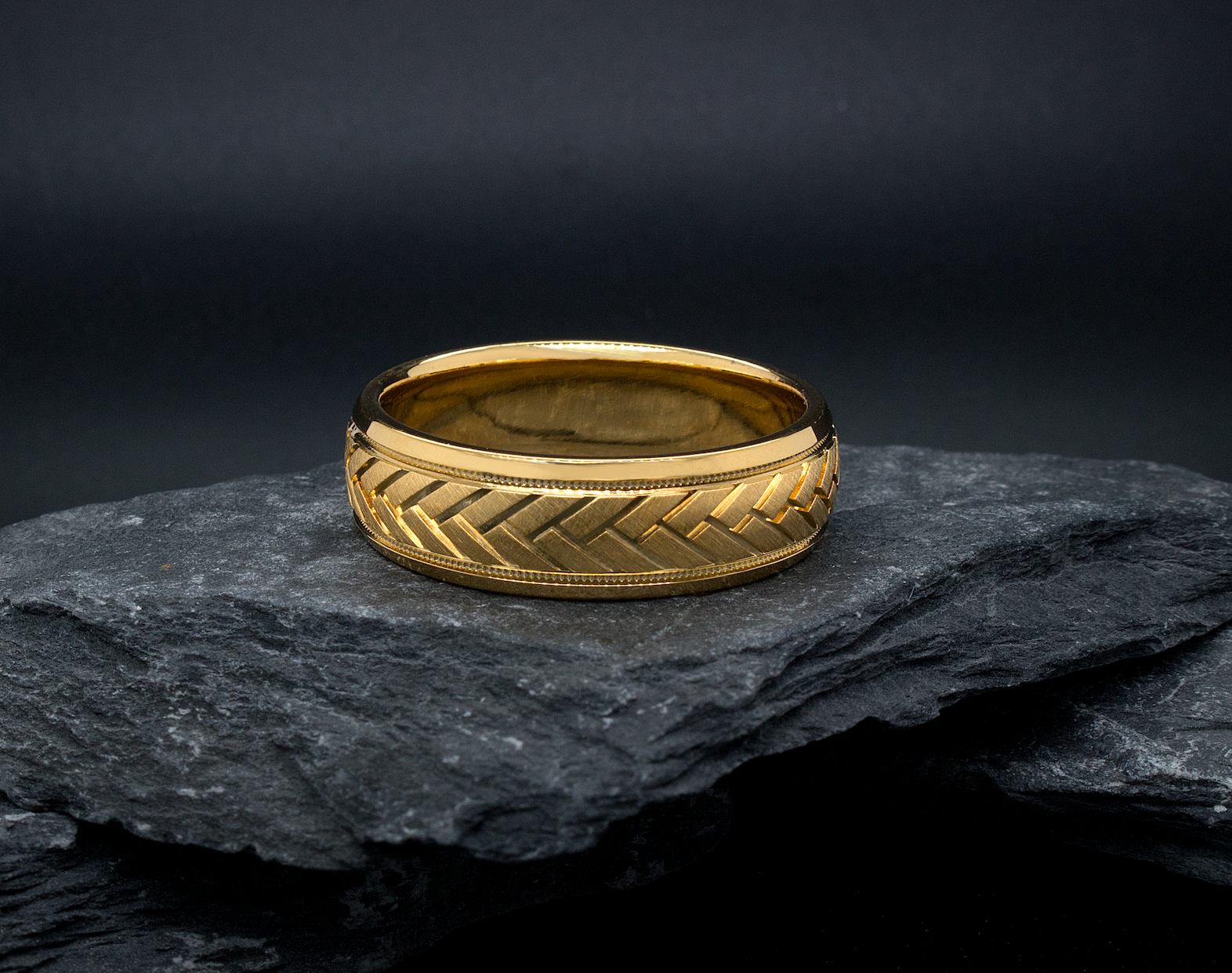 yellow gold ring, mens ring, womens ring, solid gold ring, 8mm ring, dome shaped ring, migrain, engraving, arrow pattern engraving, wedding band, mens wedding band, womens wedding band, ring on rocks