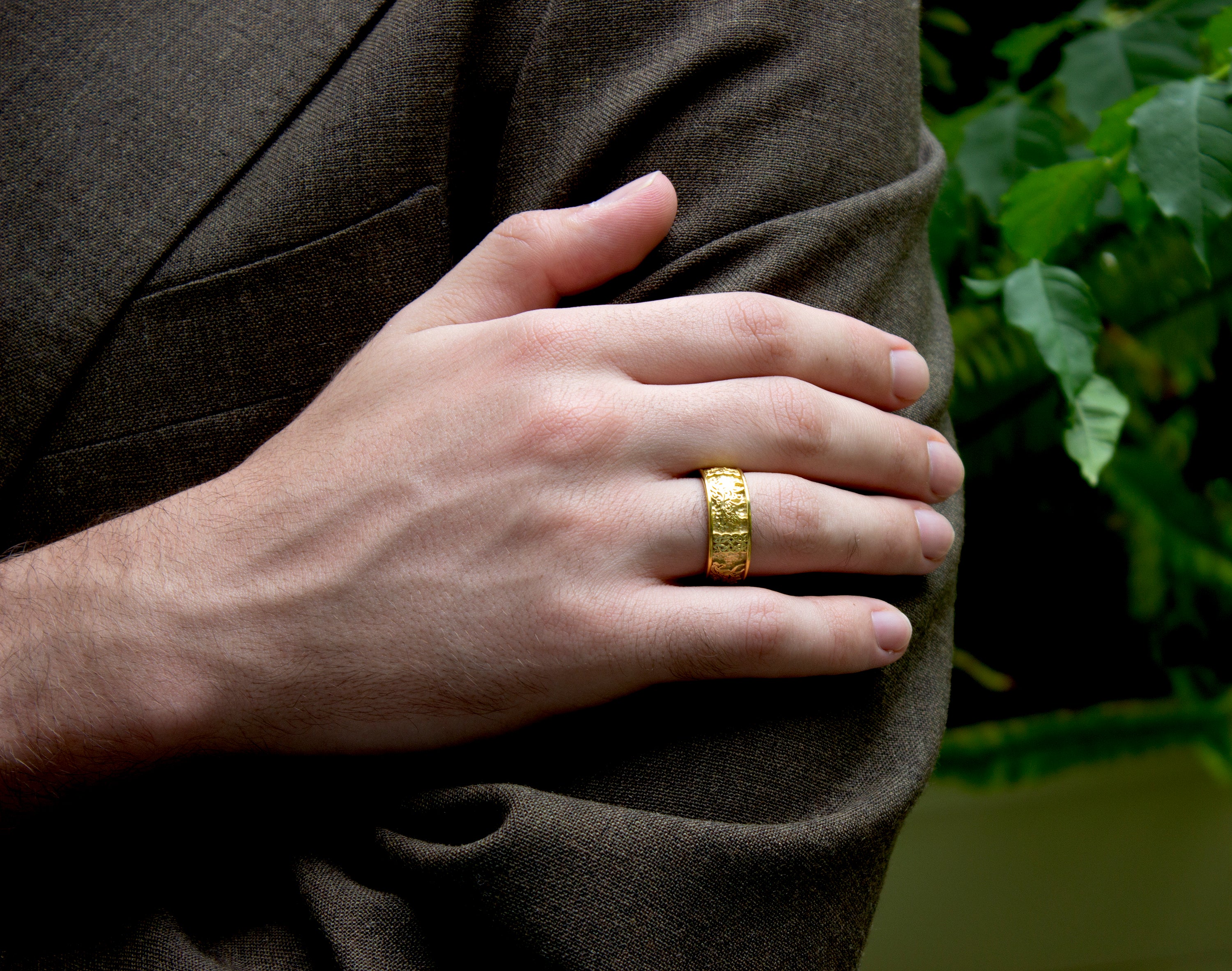 ring, ring on model, ring on finger, gold ring, solid gold ring, yellow gold ring, ring with celtic knots, celtic horses, celtic designs, engraving, mens ring, womens ring, unisex ring, wedding band, unique wedding band