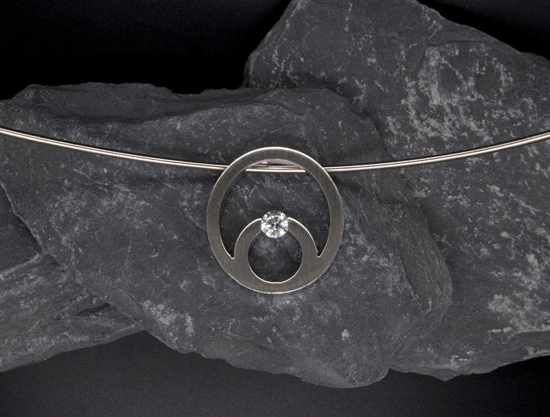 necklace, pendant, stainless steel, round pendant, stainless steel necklace, round shaped necklace, round cut diamond, unisex necklace, modern pendant, solar eclipse necklace